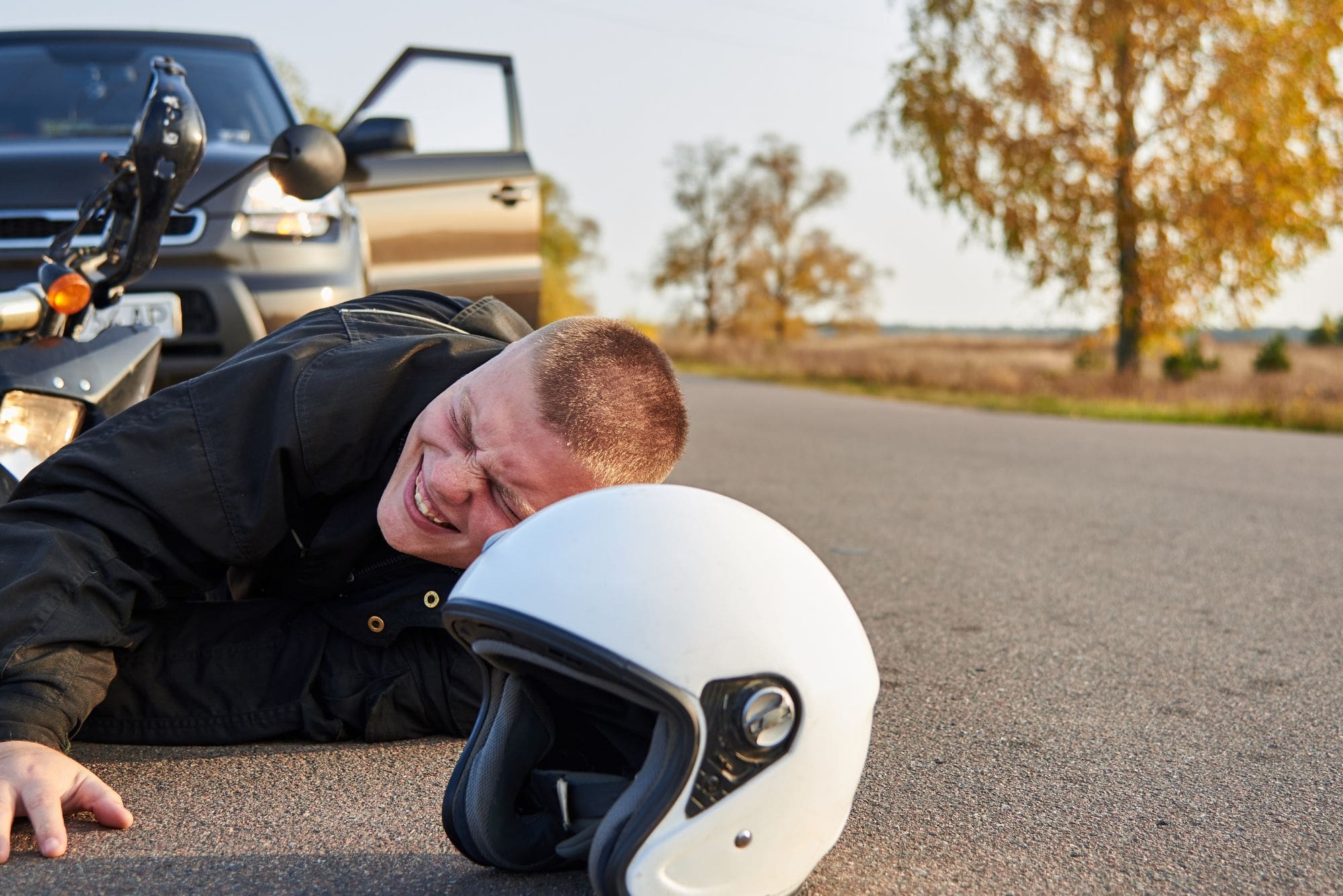 image of a man who fell off of a motorcycle